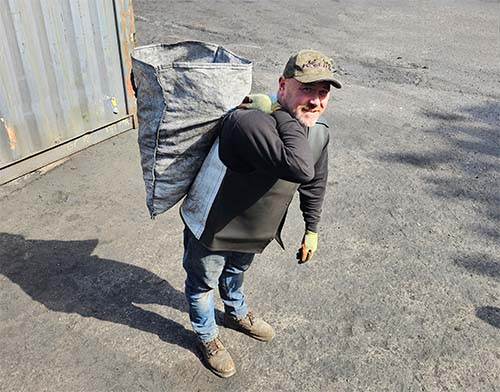 Carrying 50kg Coal Sack